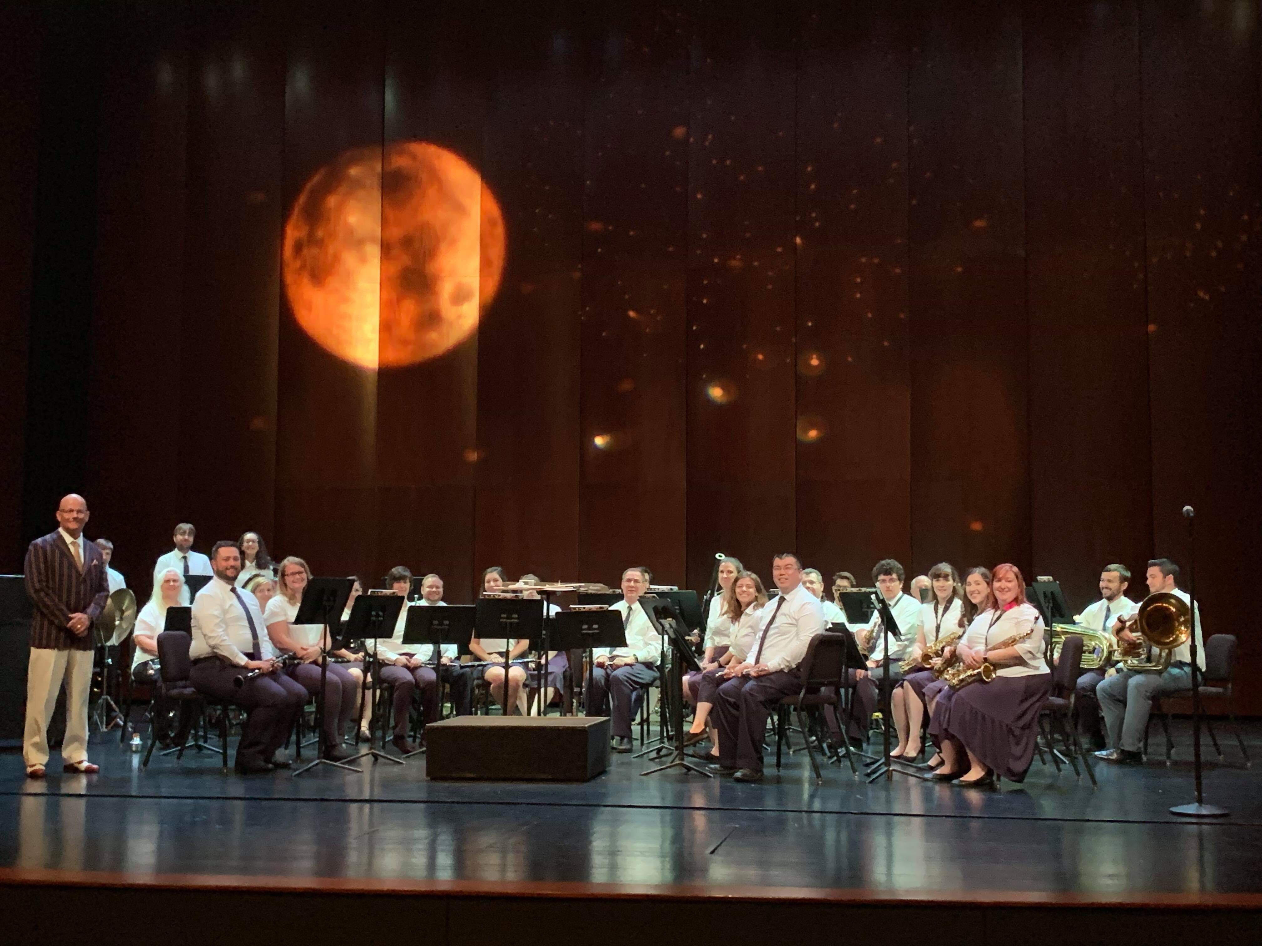 The full Dearborn Community Concert Band ensemble on stage at the Michael Guido Theater