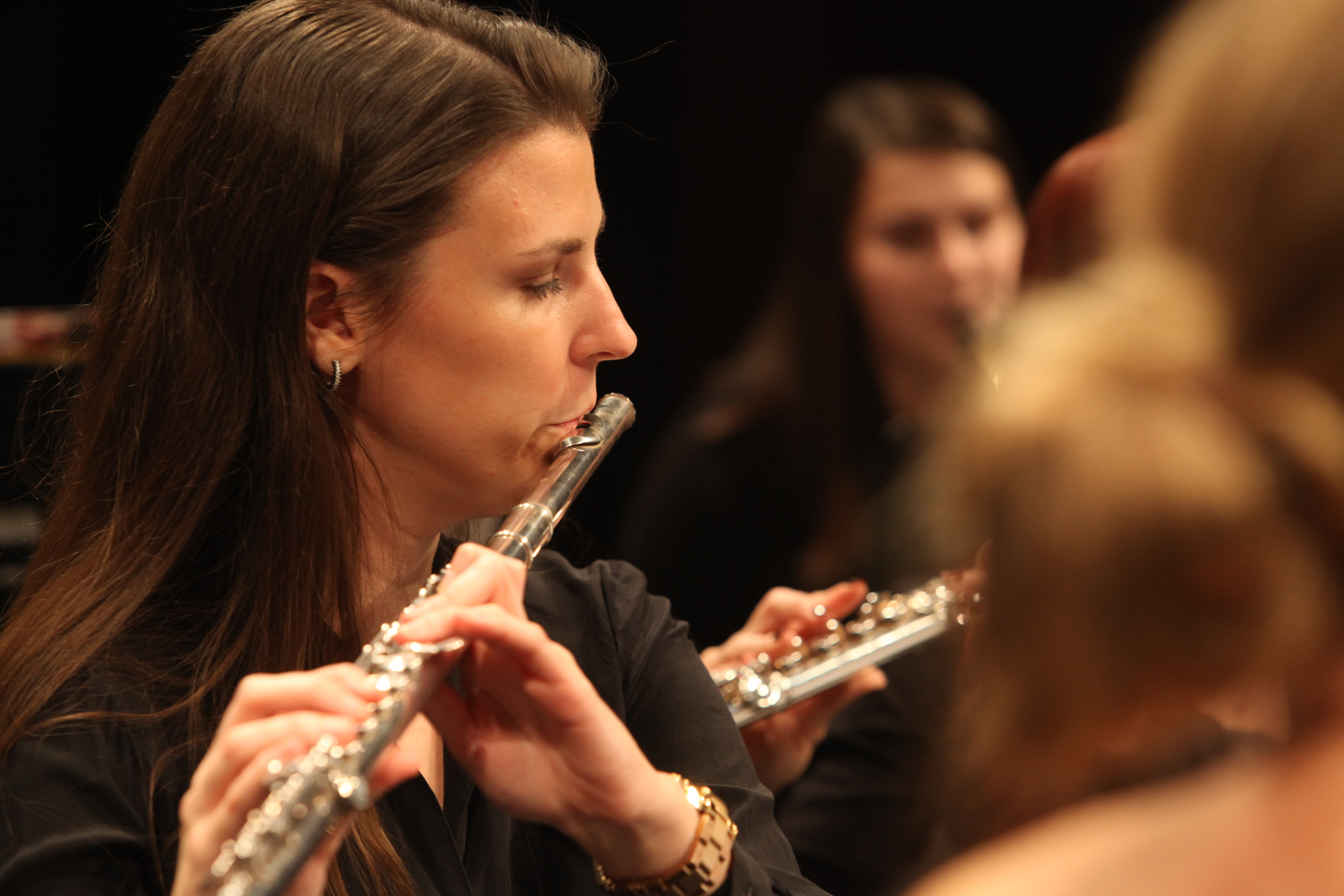 A Dearborn Community Concert Band flute player performing