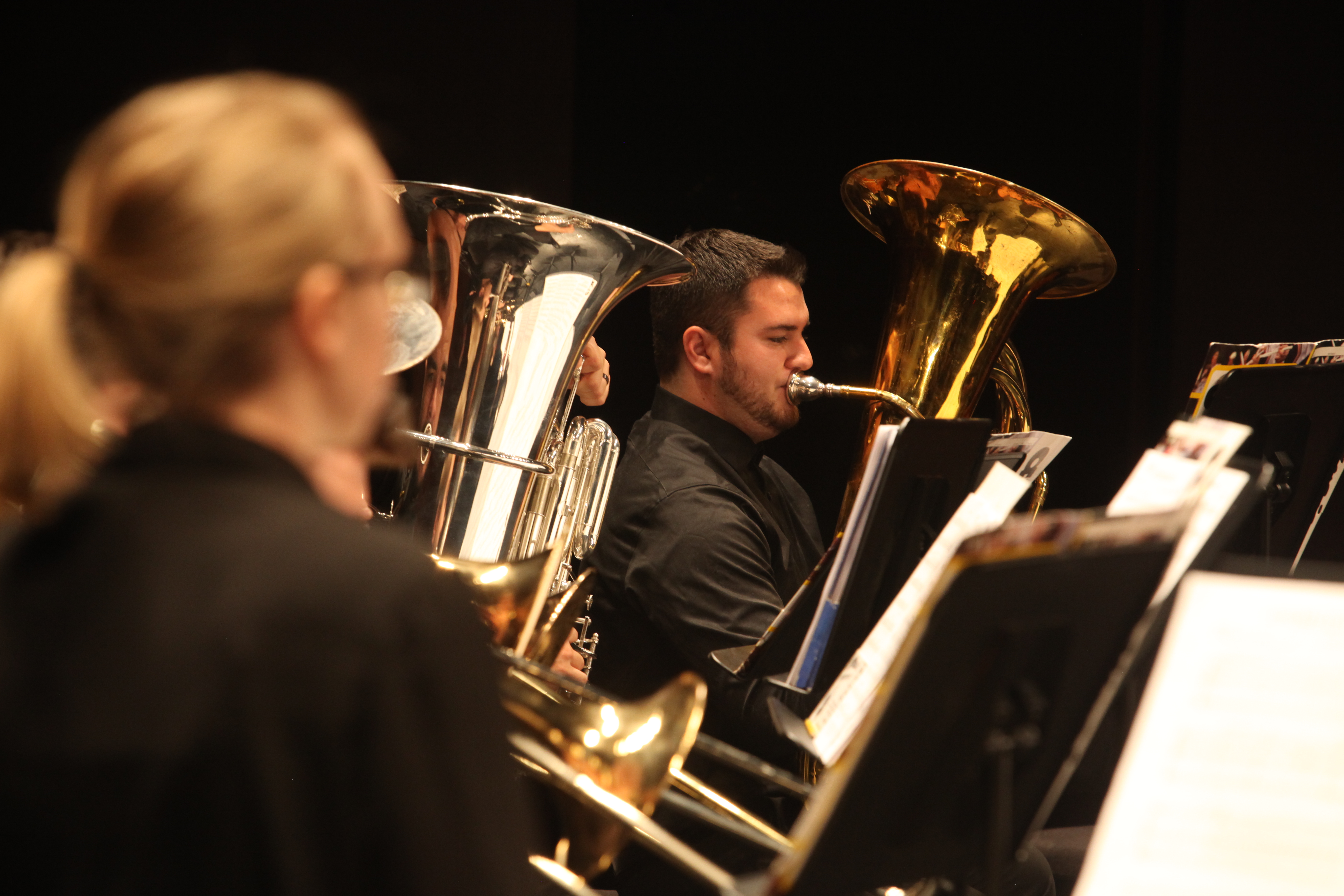 Dearborn Community Concert Band tuba and trombone players performing together
