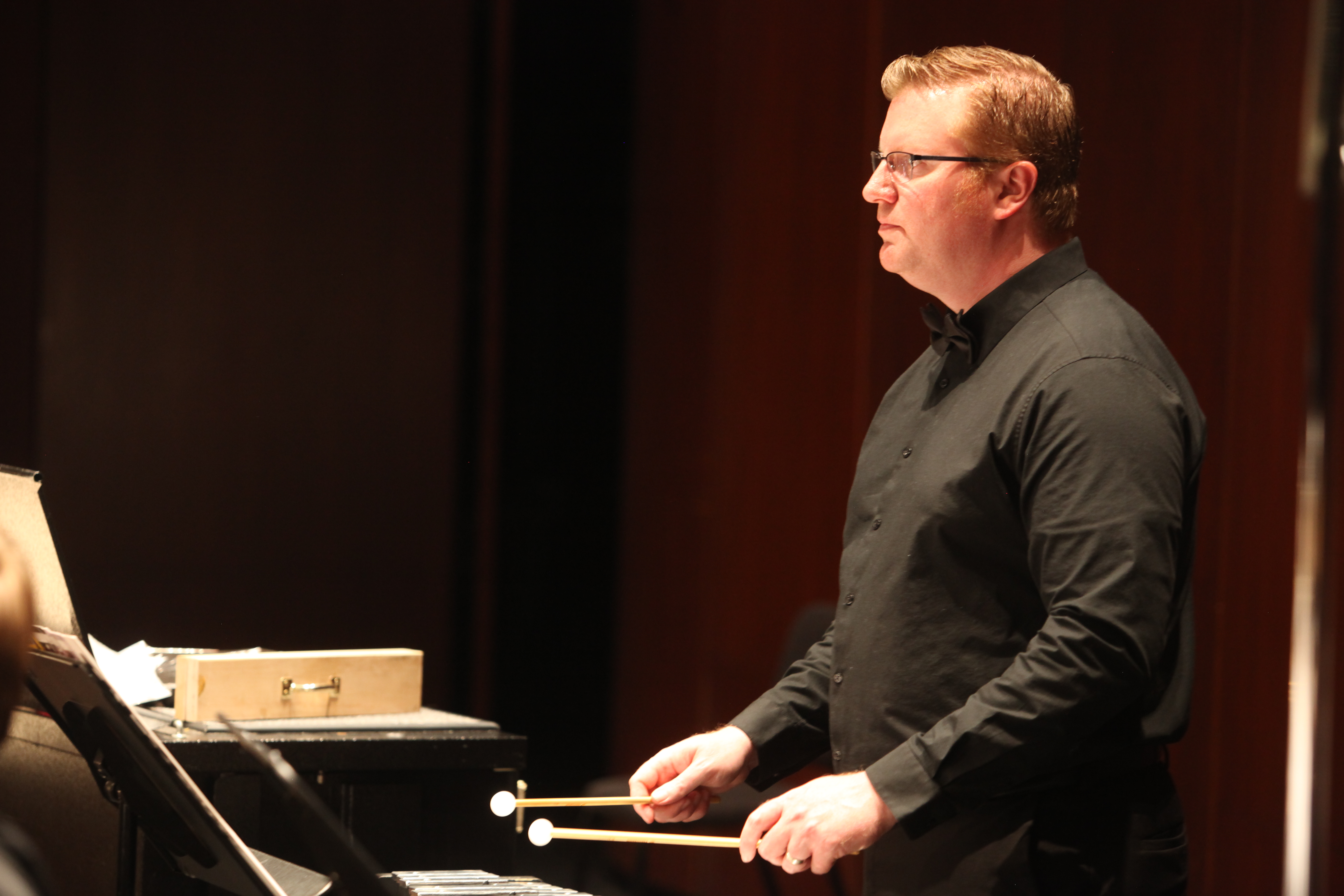 A Dearborn Community Concert Band percussionist playing keyboard mallets