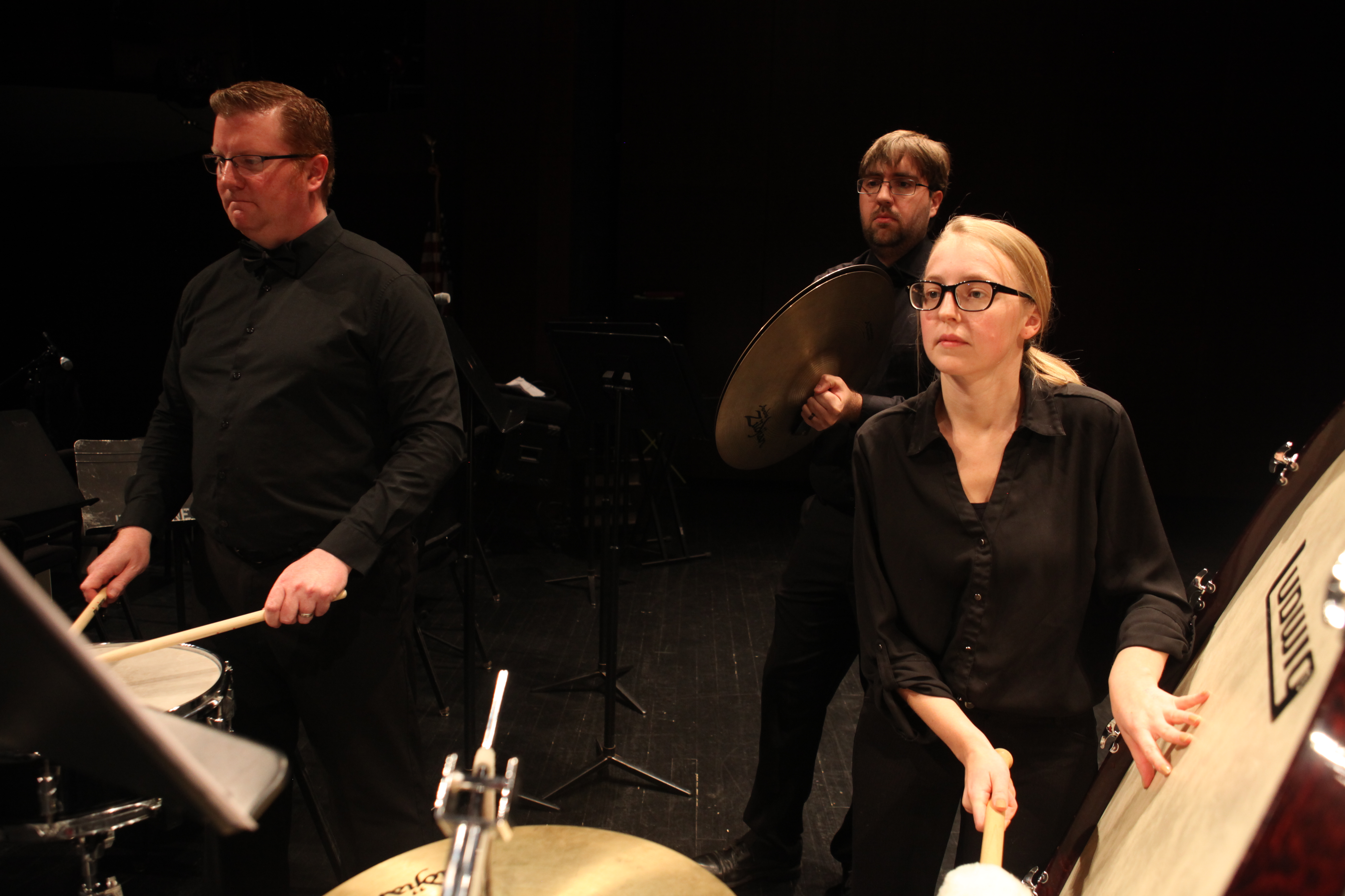 Three Dearborn Community Concert Band percussionists performing together